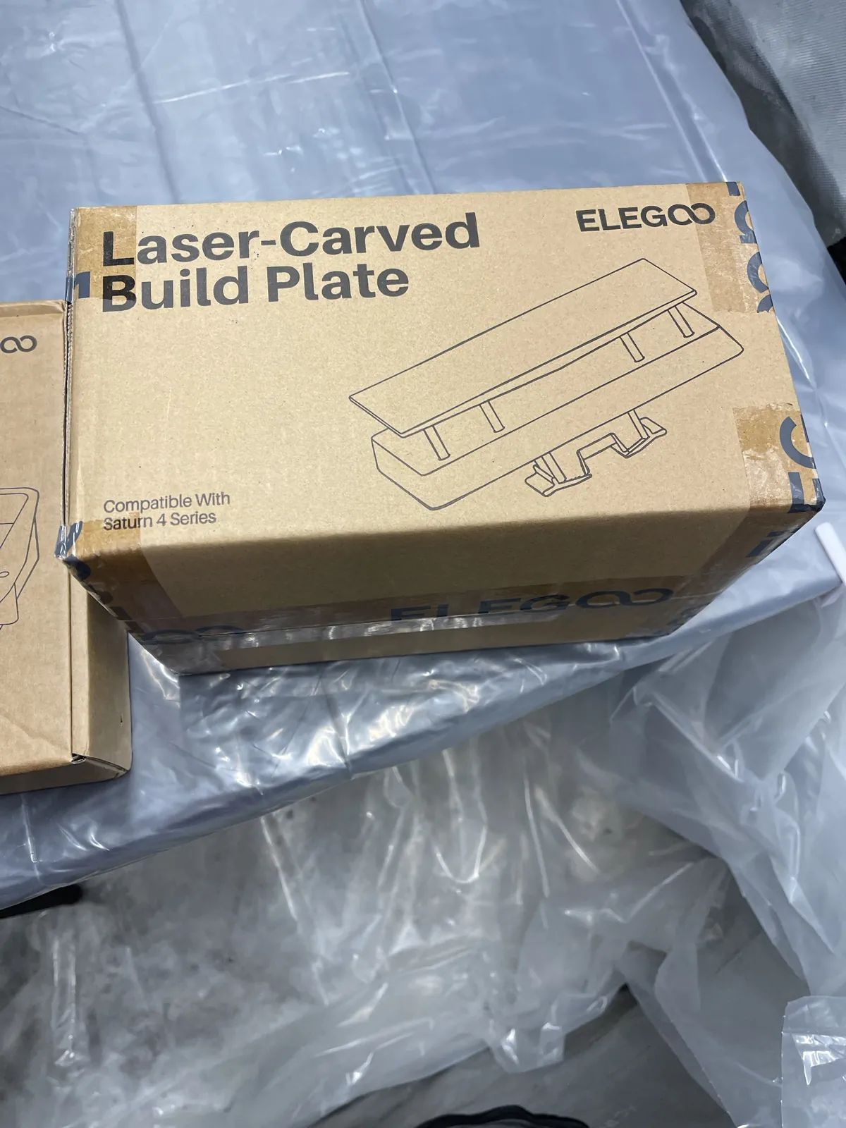 The Elegoo laser-carved build plate box for the Saturn 4 Ultra; this was the other missing part.